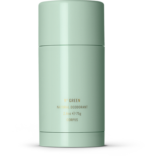 A cylindrical container of natural green deodorant on a white background.