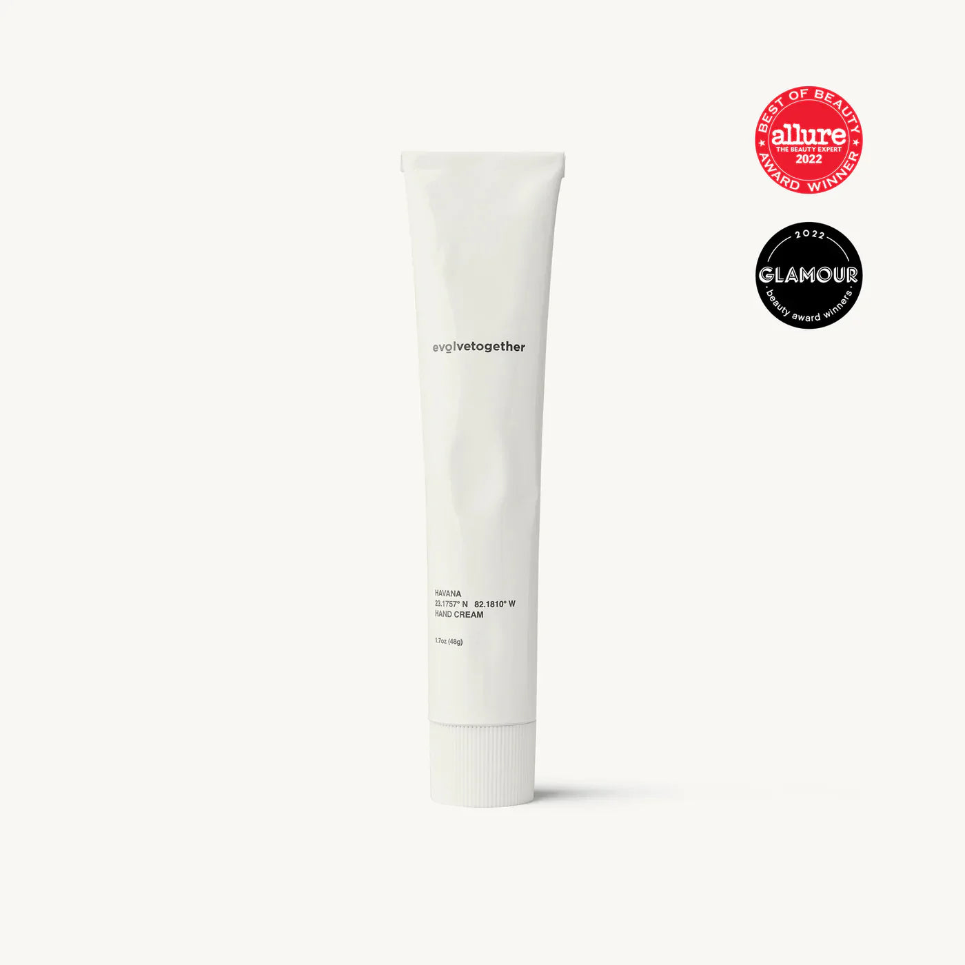 A tube of moisturizing cream with award badges from allure and glamour.
