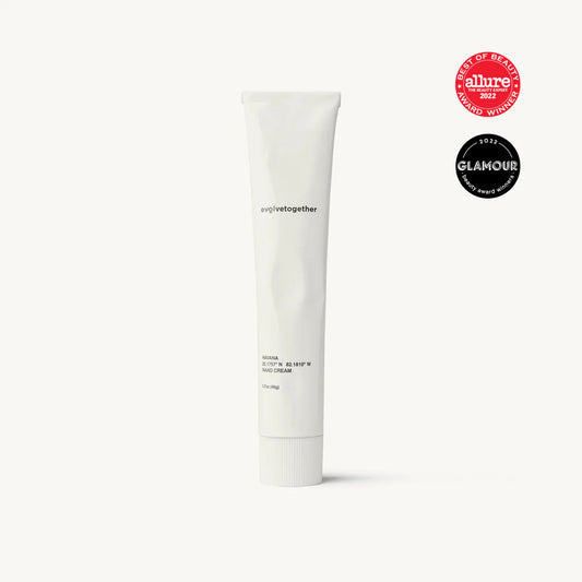 A tube of moisturizing cream with award badges from allure and glamour.