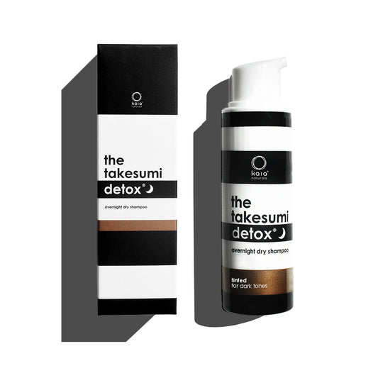 A product display of the takesumi detox overnight dry shampoo designed for dark tones.